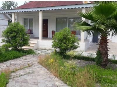 باغ ویلای روستایی با چشم‌انداز شالیزار